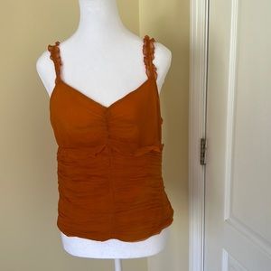 Light summer top orange color. Size medium nice top to wear with black pants.